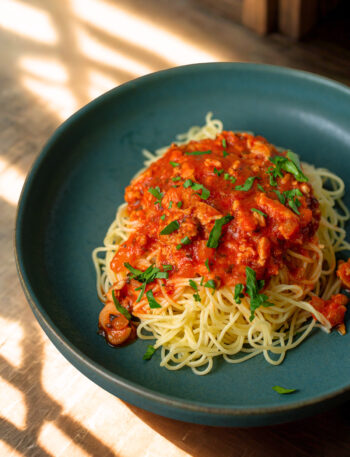 ,iced clam red sauce over pasta