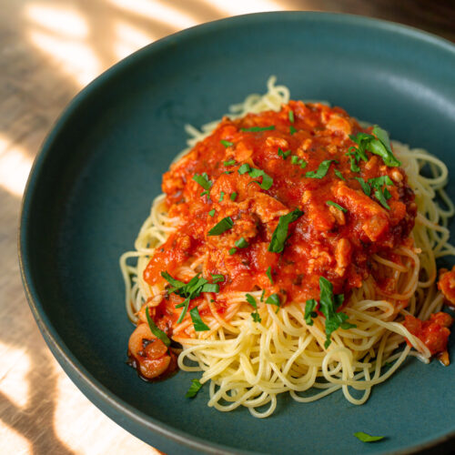 ,iced clam red sauce over pasta