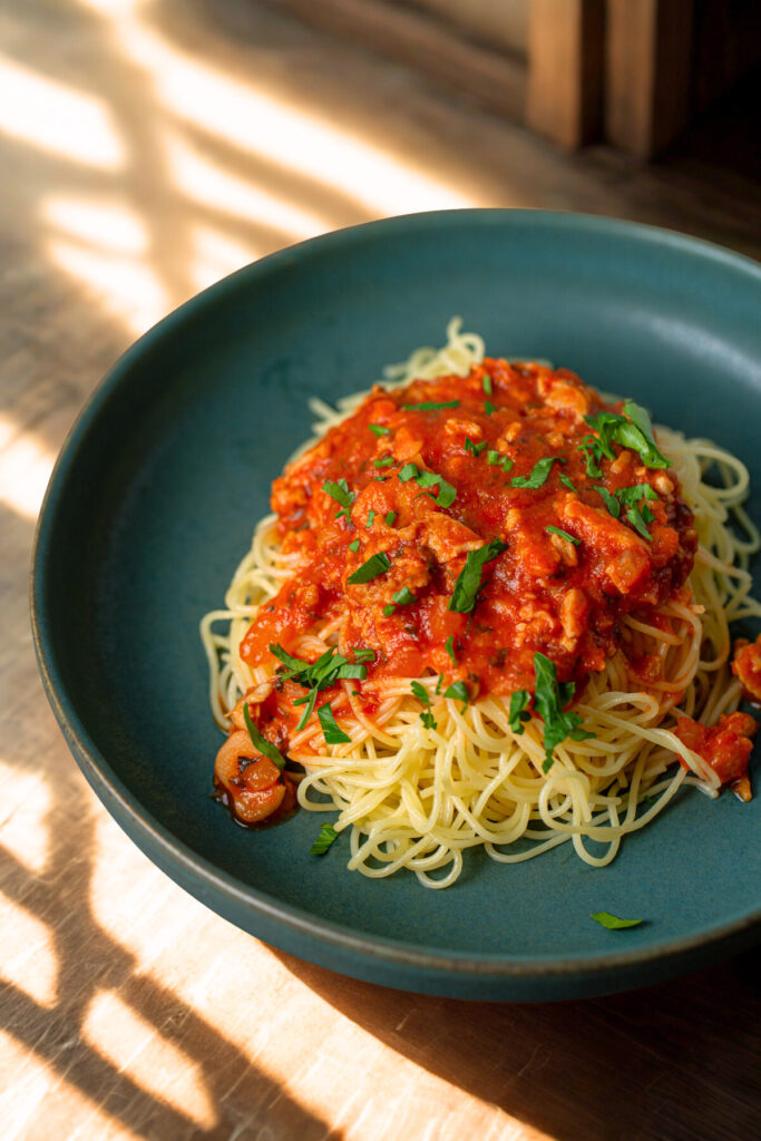 ,iced clam red sauce over pasta