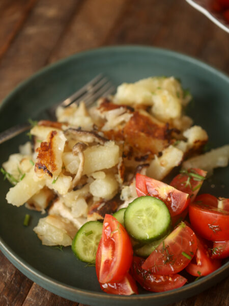 Fries Potatoes with wild mushrooms and onions and with simple cucumber and tomato salad